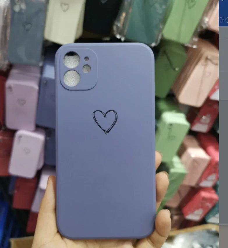 Silicone phone case for Apple iPhones in multiple solid colours including black, white, and pastel options