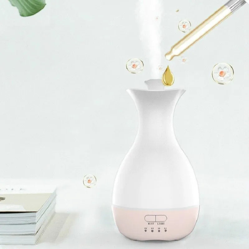 White ultrasonic air humidifier and essential oil diffuser with colourful night light and 200ml water tank