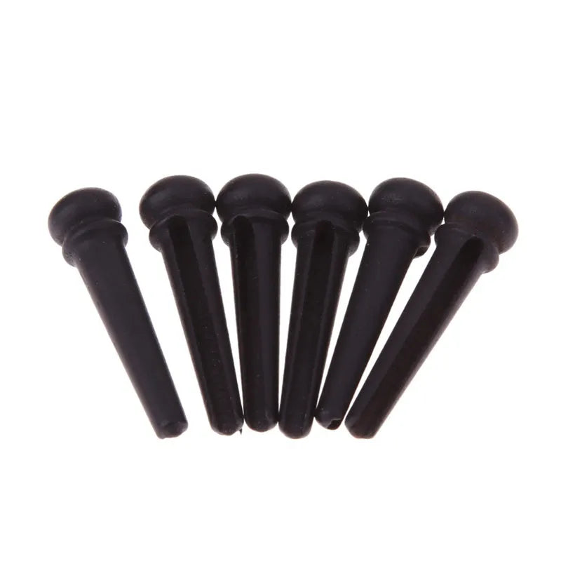 Six ebony guitar string nails with matt black finish for folk acoustic guitar bridge installation