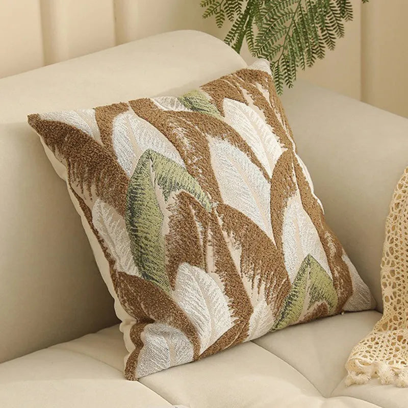 Jacquard floral pattern cushion cover in a retro colour, 45cm square, on a sofa.