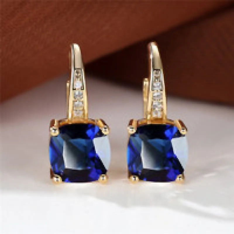 Geometric copper ear clip with colourful moissanite stones in quadrilateral pattern