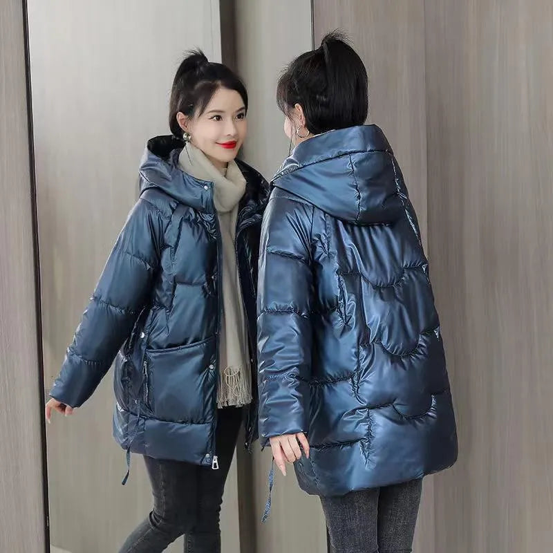 Women's loose fit thick hooded down cotton jacket in black, shown with long sleeves and a front zip.