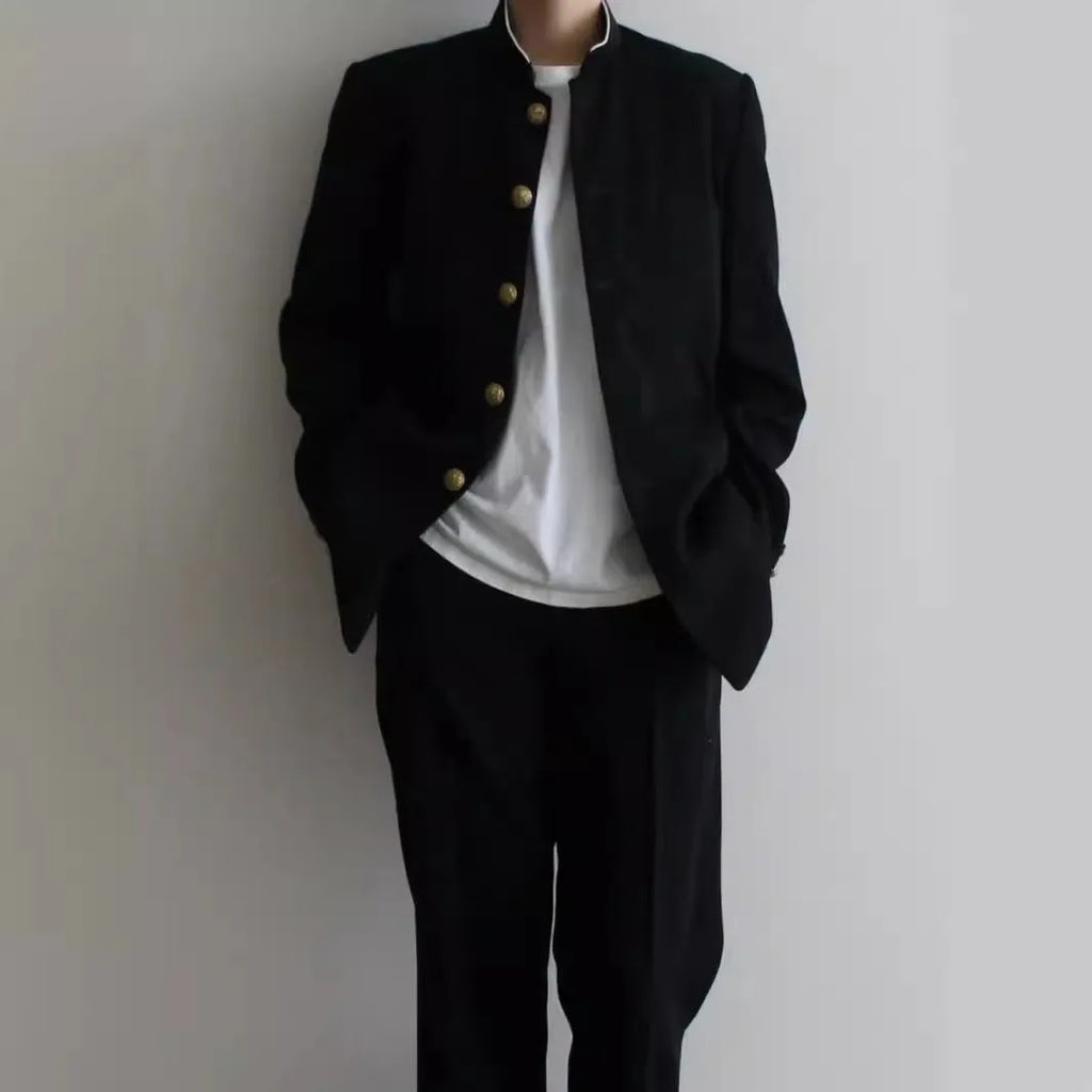 Solid black Korean style casual suit blazer with long sleeves, loose fit, and patch pockets on model