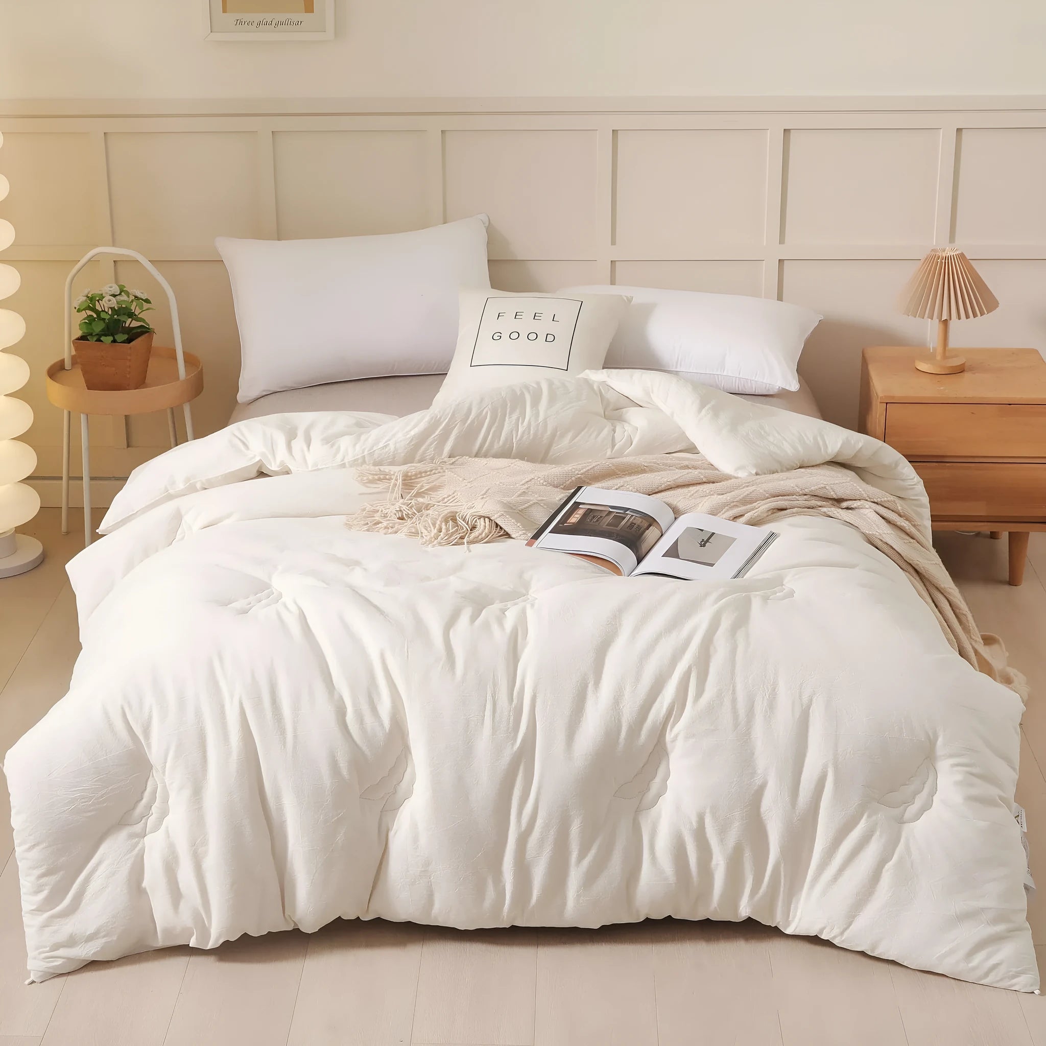 A pure cotton soybean fibre airable quilt in grey, shown with a zipper detail, on a bed.