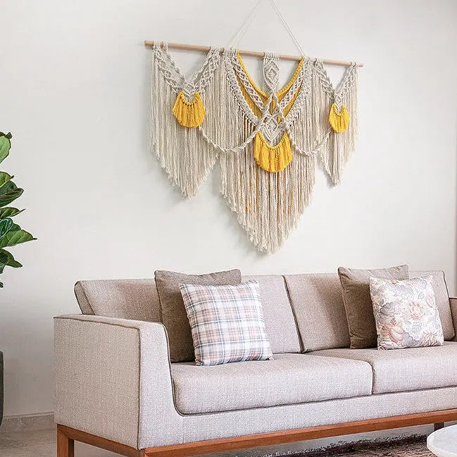 Hand-made cotton Nordic tapestry wall hanging in creamy white with yellow accents, 120cm by 95cm