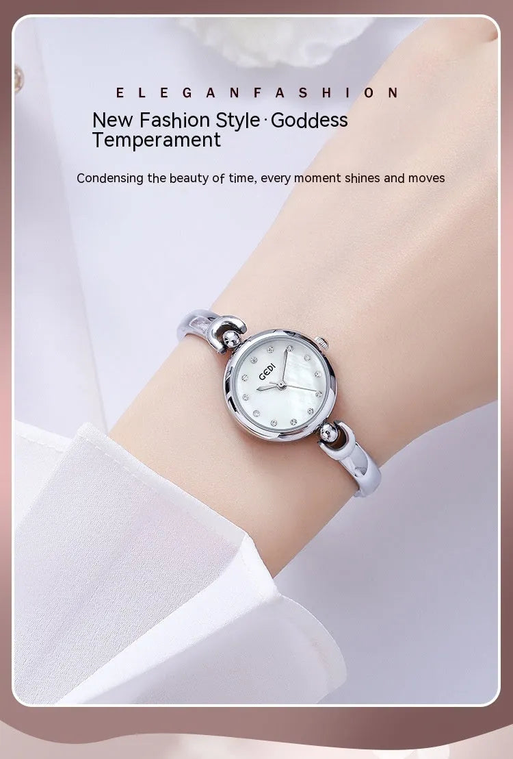 Silver case women's bangle watch with round dial and white plate silver stripe