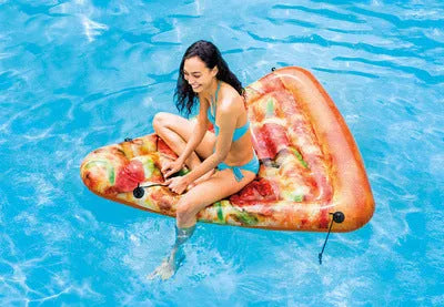 Pizza-shaped inflatable surfboard recliner floating on water, showing large 175cm size
