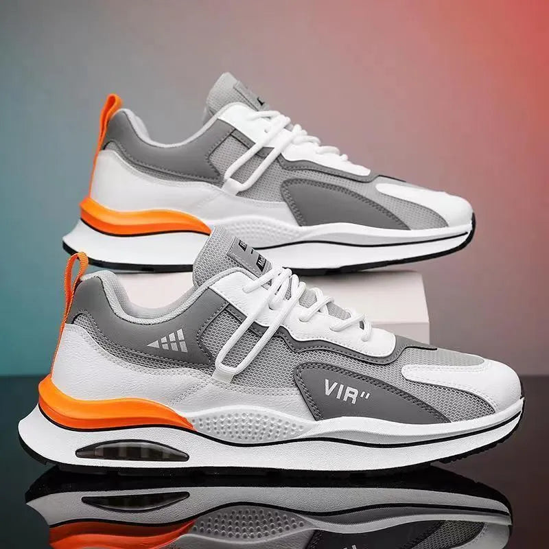 Men's gray breathable mesh running shoes with a round toe and casual sewing thread details on a white background.
