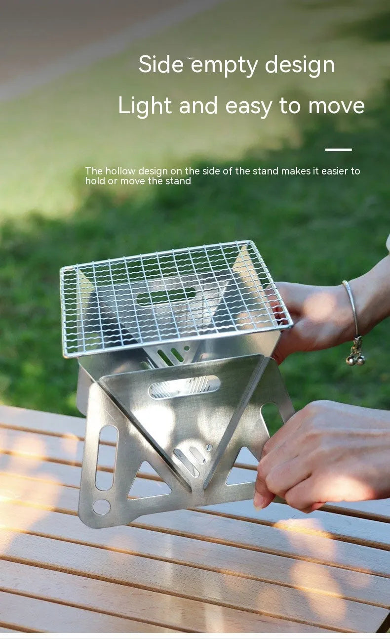 Folding stainless steel portable barbecue oven with large grill and storage bag.