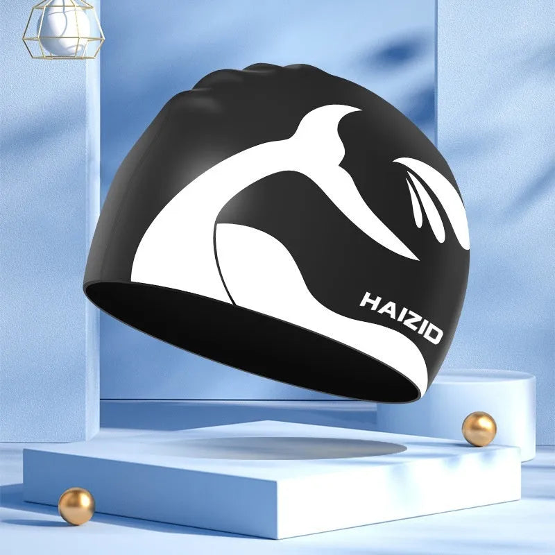 Silicone swimming cap with waterproof ear protectors showing whale tail pattern in multiple colour options