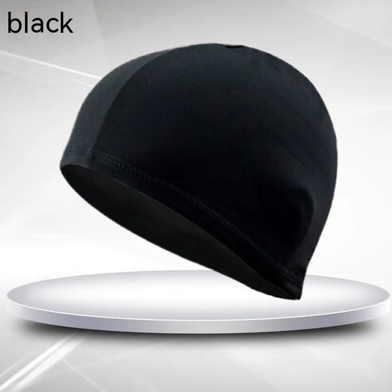 A solid black cloth swim cap for adults made from polyester fabric.
