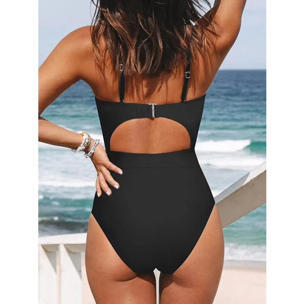 Women's black one-piece backless swimsuit made from polyester and spandex on a mannequin.