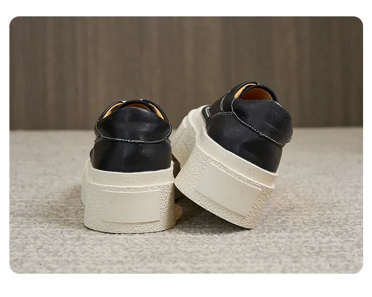 Women's black platform sports shoes with embossed cowhide upper and rubber sole, tied design detail