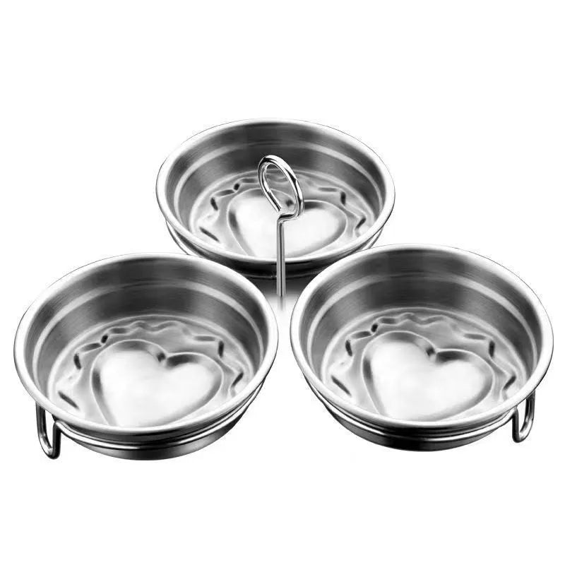 Heart-shaped stainless steel mini egg steamer for cooking individual eggs on stovetop