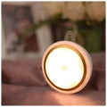 Round white motion sensor LED light unit with 80mm diameter, for cupboard or wall mounting.