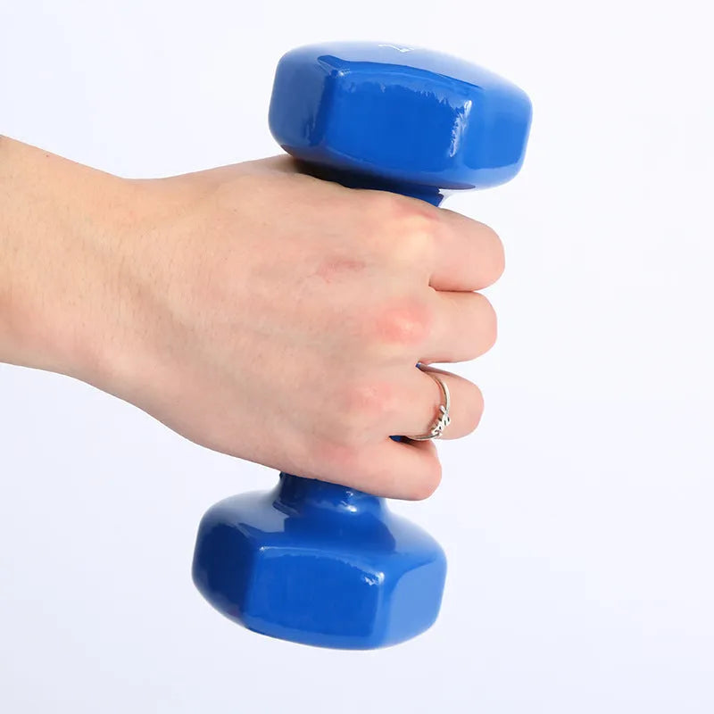 Bright coloured plastic dumbbells in 0.5kg, 1kg and 1.5kg sizes for home fitness with glossy surface