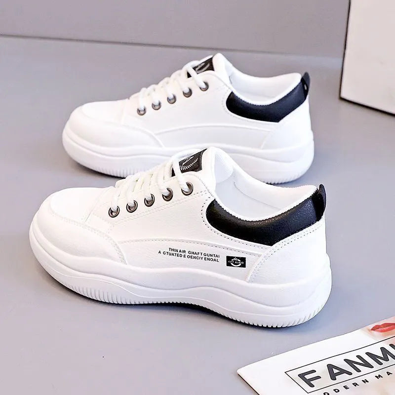Women's white Korean-style leather pumps with cross straps and a flat mid-height heel.