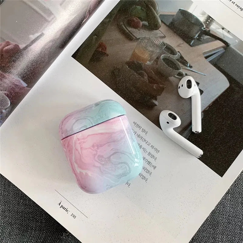 White Marble hard PC protective case fitted on an AirPods wireless charging case.