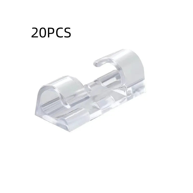 Transparent self-adhesive plastic snap clips for cable management on a white background.