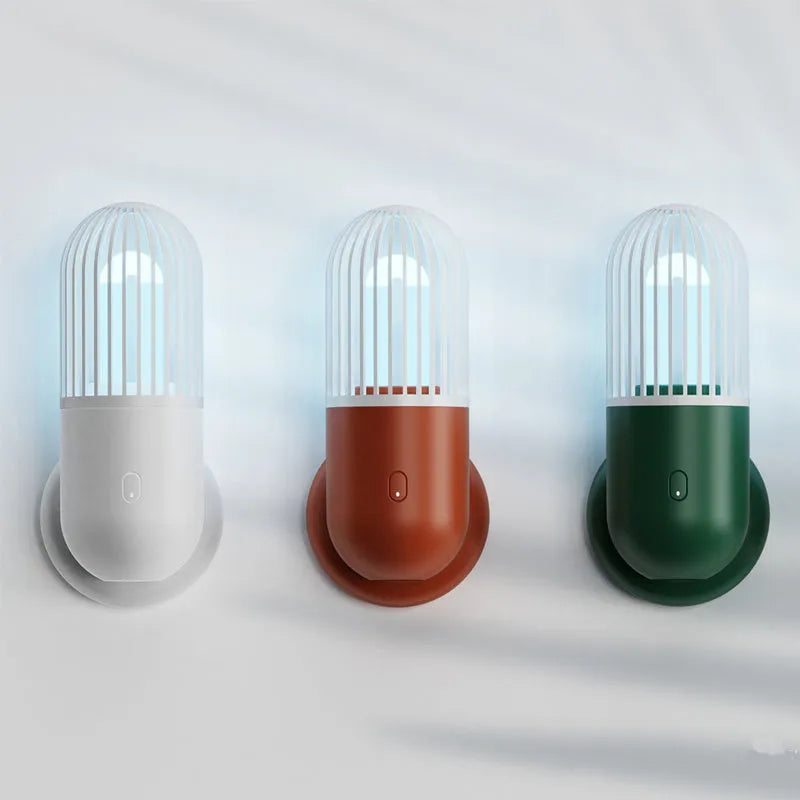 Portable capsule ultraviolet disinfection lamp in black, brown, green or white with display showing 52x52x136mm dimensions