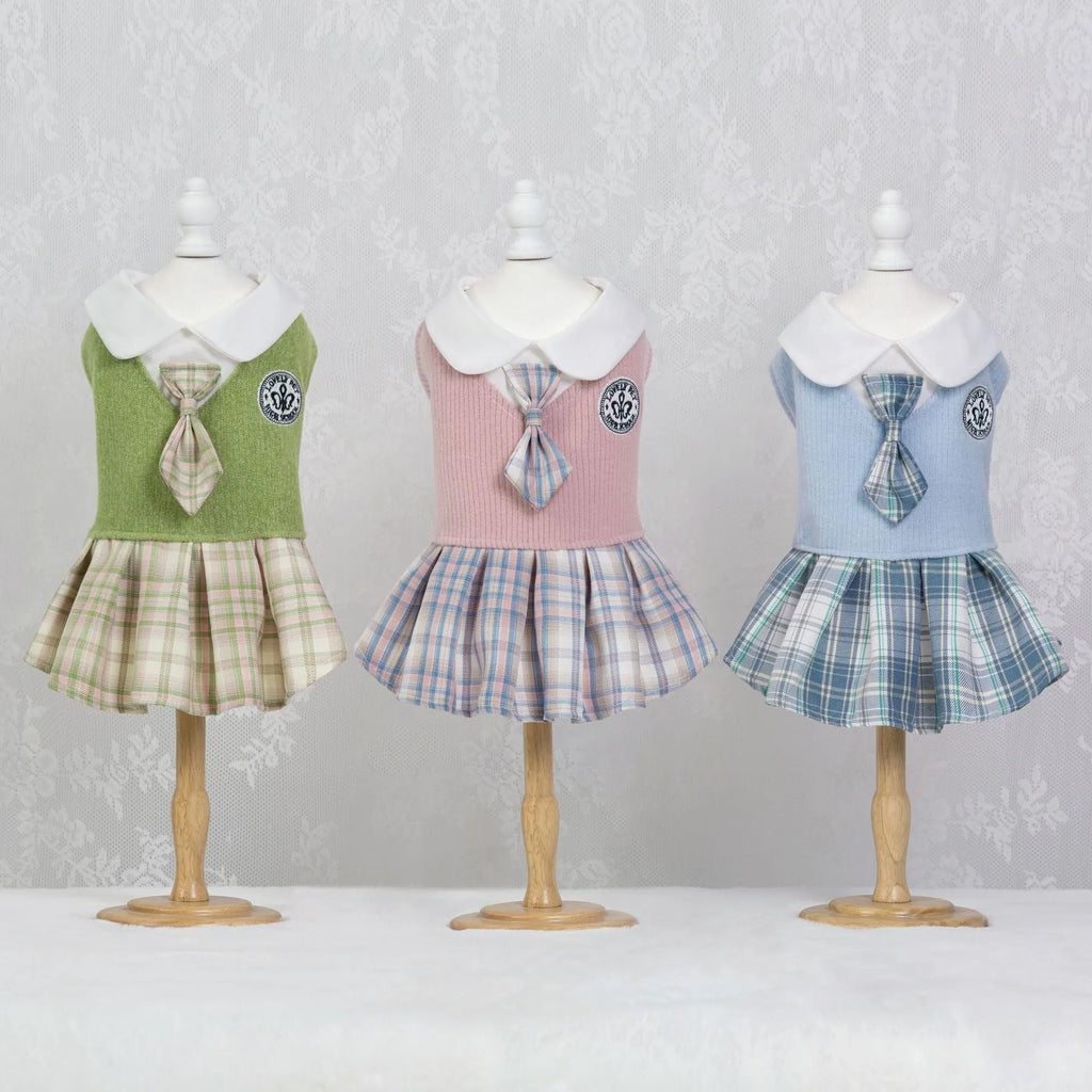 A pink tartan skirt for a small dog, showing the elastic waistband and princess-style flare.