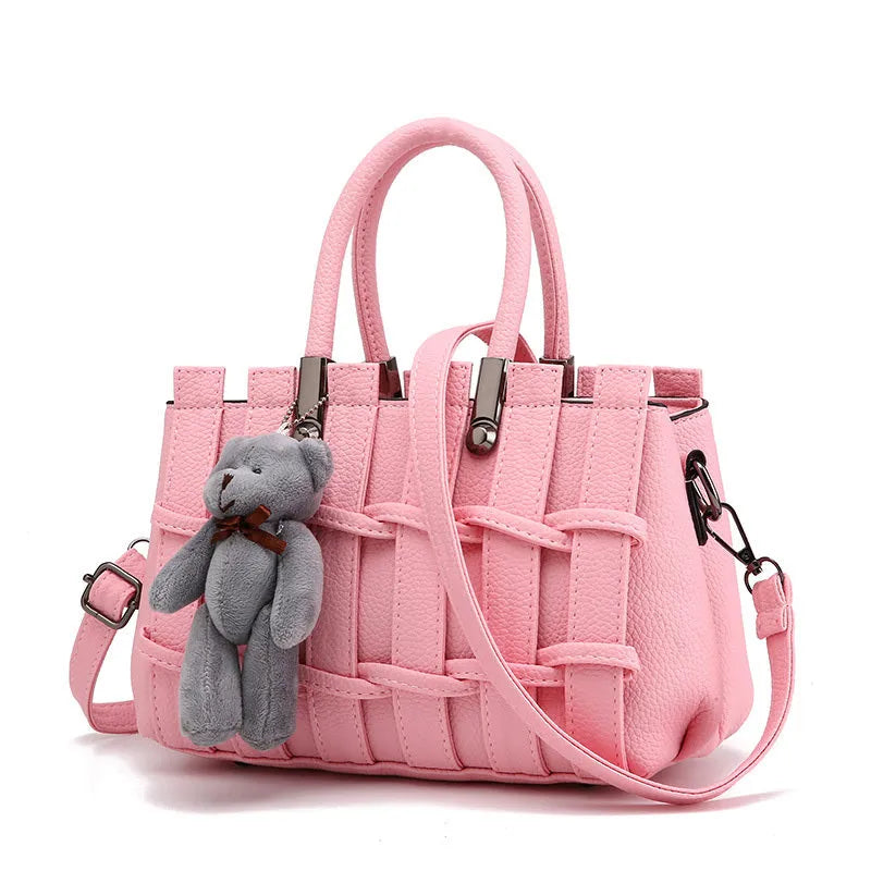 Women's PU shoulder handbag in black with multiple internal pockets and polyester lining
