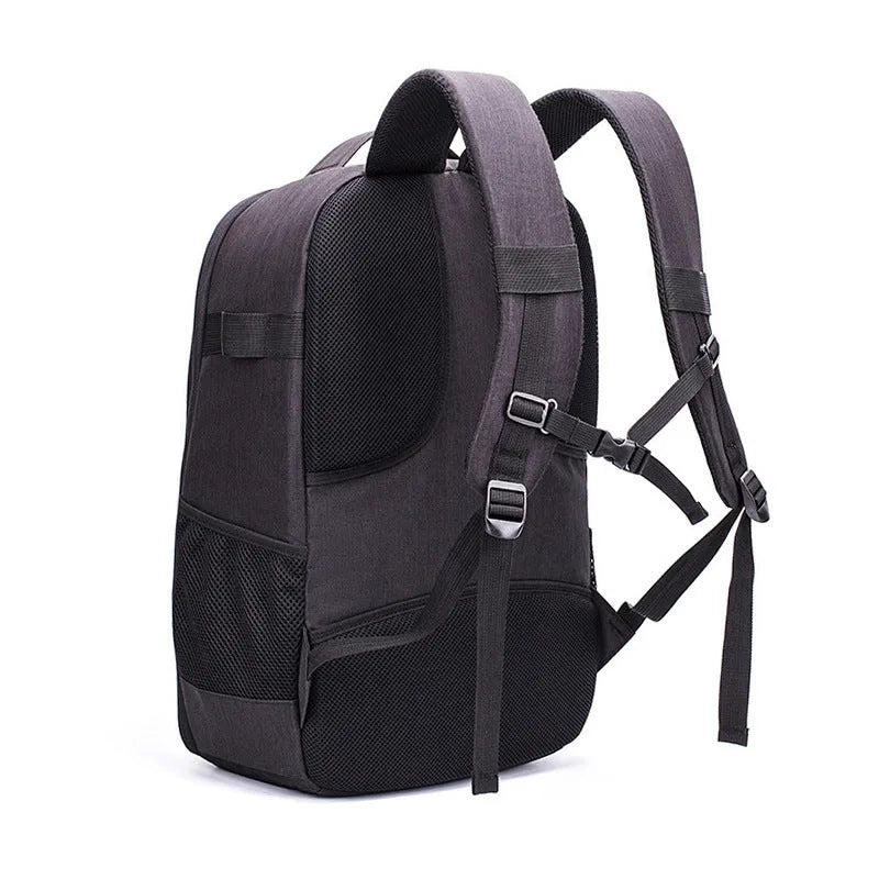 Large black Oxford fabric drone backpack showing multiple internal organiser pockets for laptop and camera.