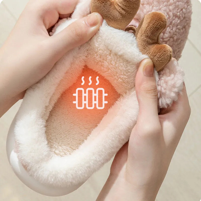 Pair of Christmas elk winter home slippers with suede upper, available in candy colours