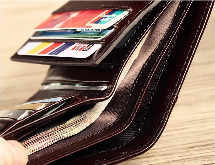 Men's leather wallet showing internal organisation compartments for cards, cash and coins