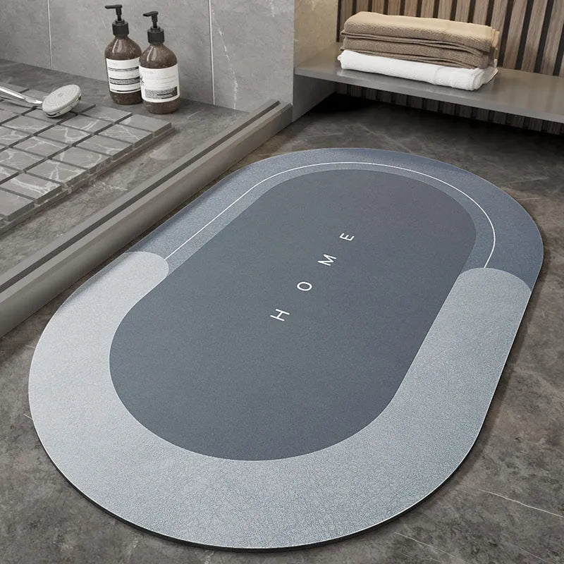 Blue oval blended fabric bathroom floor mat on a tiled floor