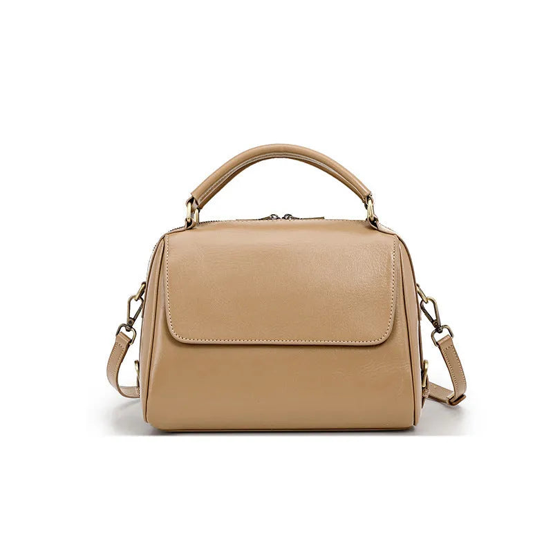Women's soft genuine leather crossbody tote bag in a square shape with a double strap, shown in apricot colour.