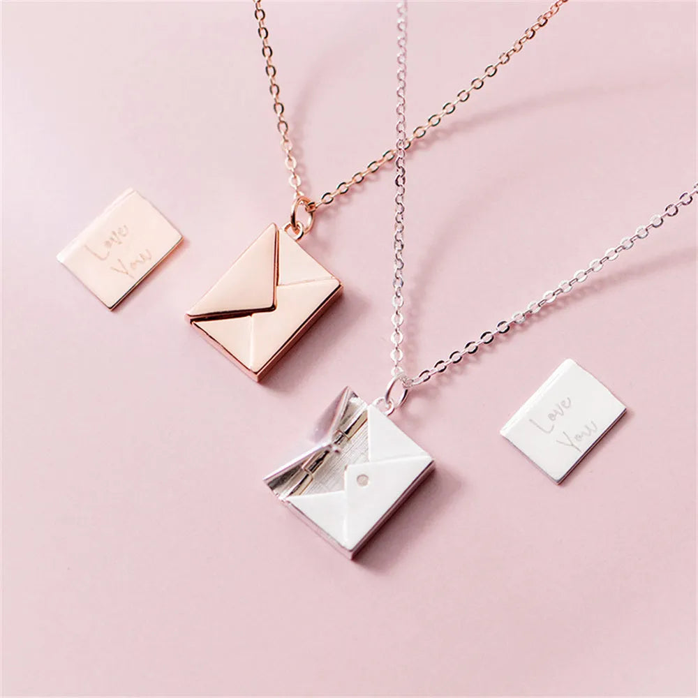 Gold envelope-shaped locket pendant on a stainless steel chain with custom engraving option