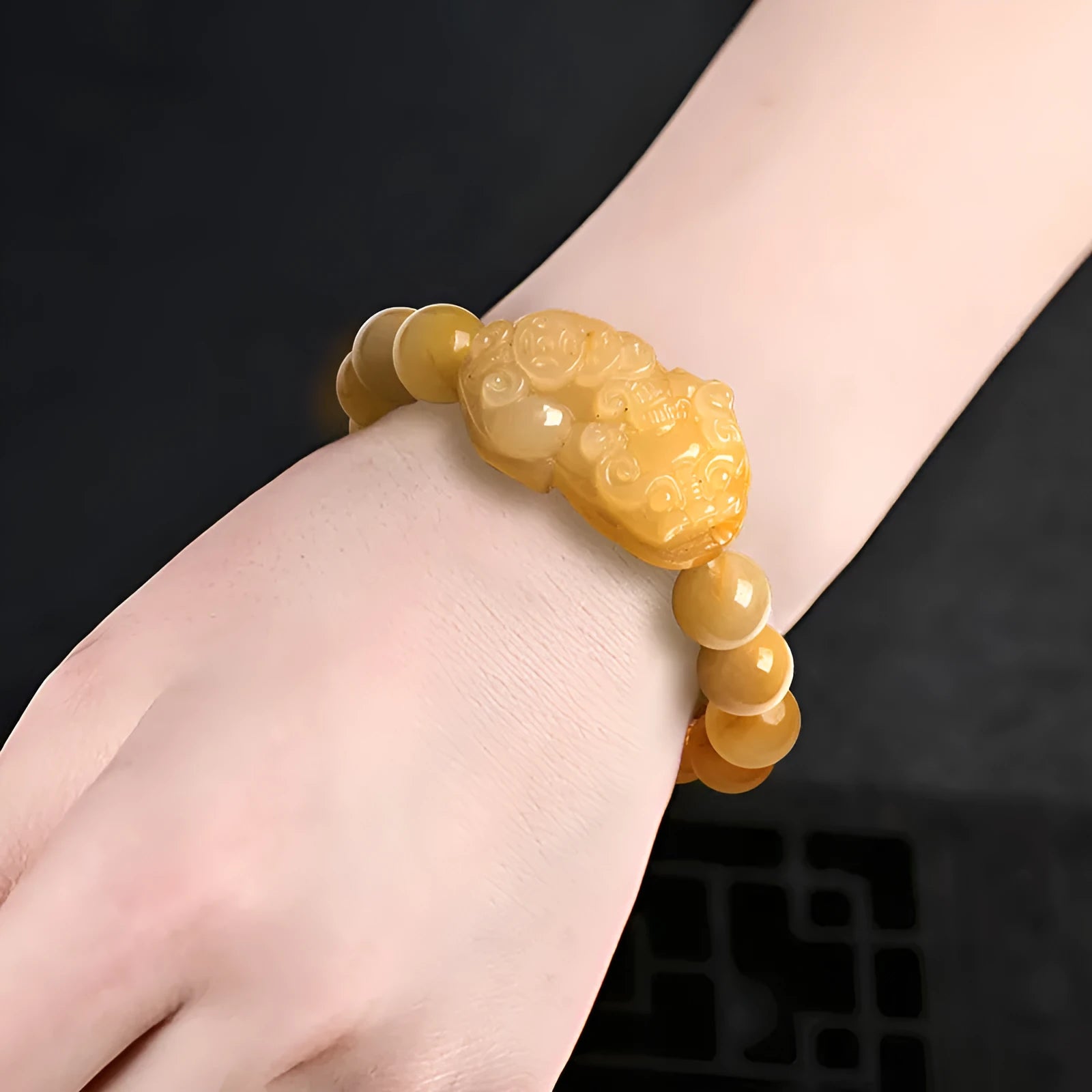 Carved Jinsi Jade money bracelet in golden thread colour showing large and small size options.