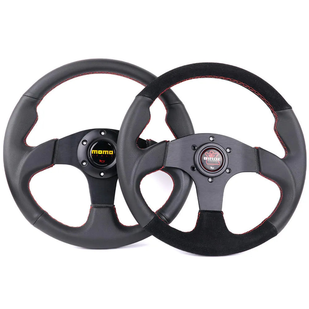 13 inch BRIDE microfiber leather flat steering wheel on black bracket with screw holes visible