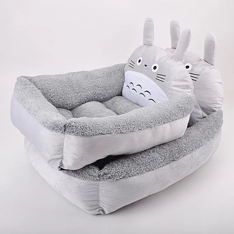 A cartoon-style washable pet sofa bed for small dogs and cats, shown in blue, brown, gray, or pink.