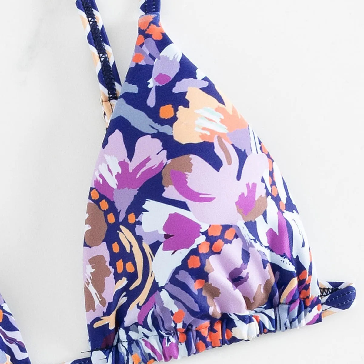 Women's floral printed polyester swimsuit with triangle bag design and briefs style bottom in S, M, L sizes