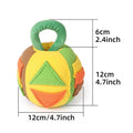 Green plush squeaky ball dog toy with treat pockets on a white background
