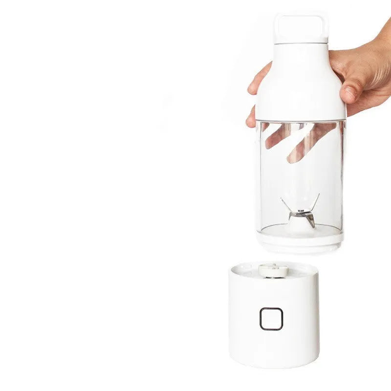 Portable mini juice cup blender with 180W motor and high borosilicate glass liner in pink on a white surface