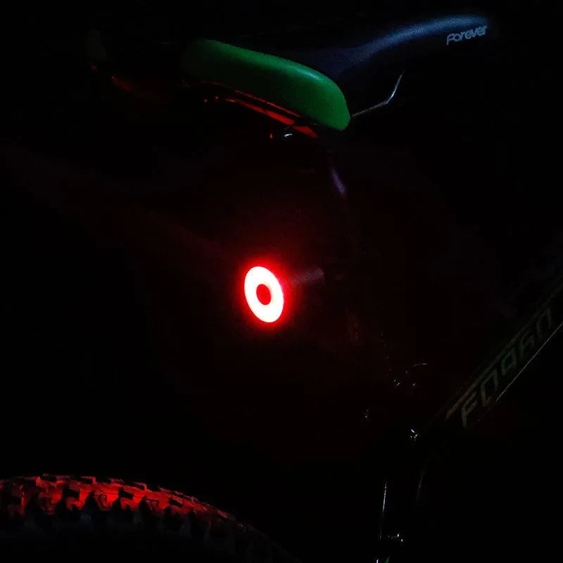 ENFITNIX Xlite100 bicycle taillight with 6061 aluminium chassis, mounted on seat rail, black body with red lens