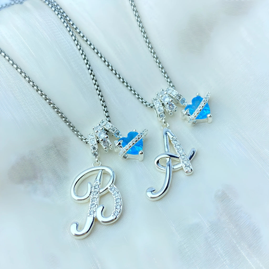 Copper English letter necklace with 26 alphabet charms in gold and silver style on display