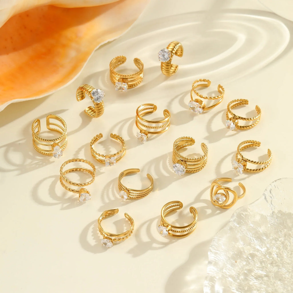 Open mouth geometric stainless steel ring with heart drop shape and gold inlaid zircon.