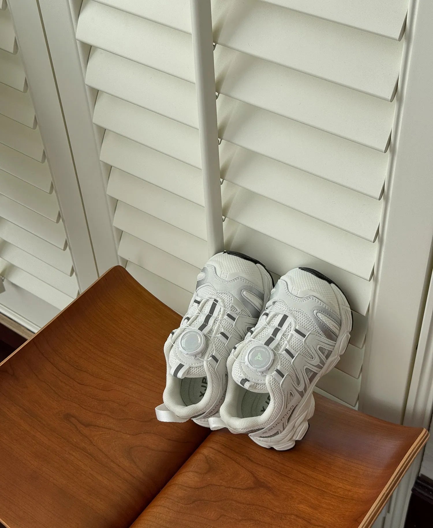 Girls lightweight casual sneaker in breathable mesh, available in black, beige, or pink.