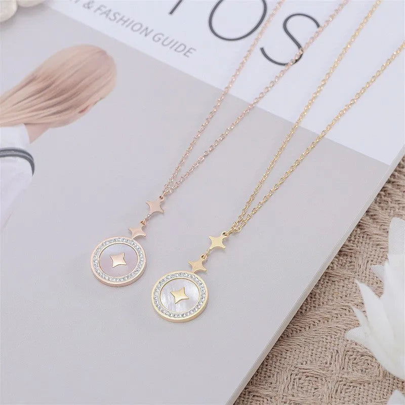 Gold titanium steel necklace with six-pointed geometric star pendant on an O-ring chain.