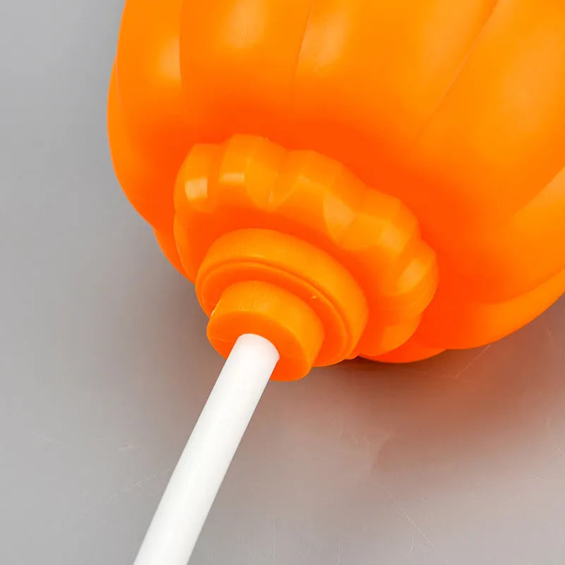 Plastic pumpkin lamp with USB charging cable in yellow or purple light colour