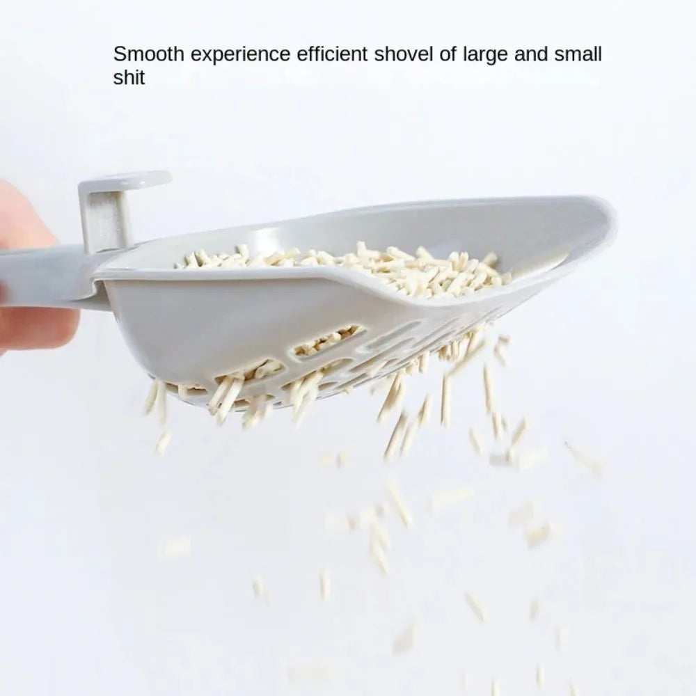 Grey plastic cat litter scoop with handle and stand-up base.