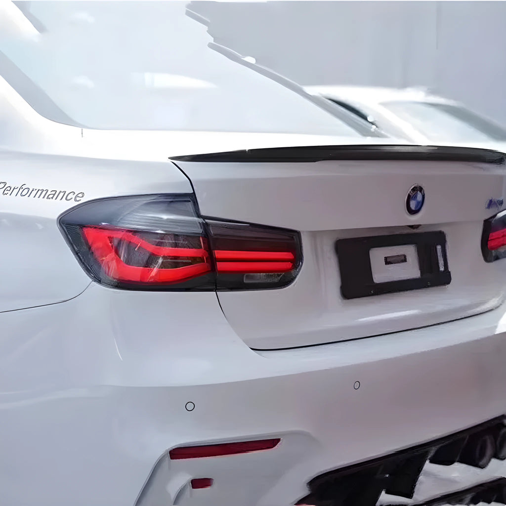 BMW 3 Series LED tail light assembly with streamer pattern in red or smoked black for 12-15 year models