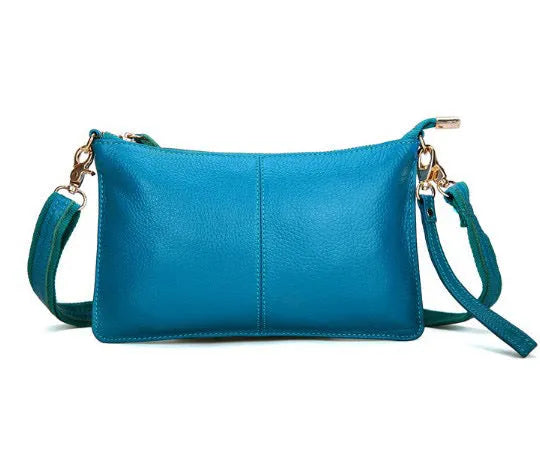 Lady cowhide slant bag in apricot showing top layer leather texture and dual straps