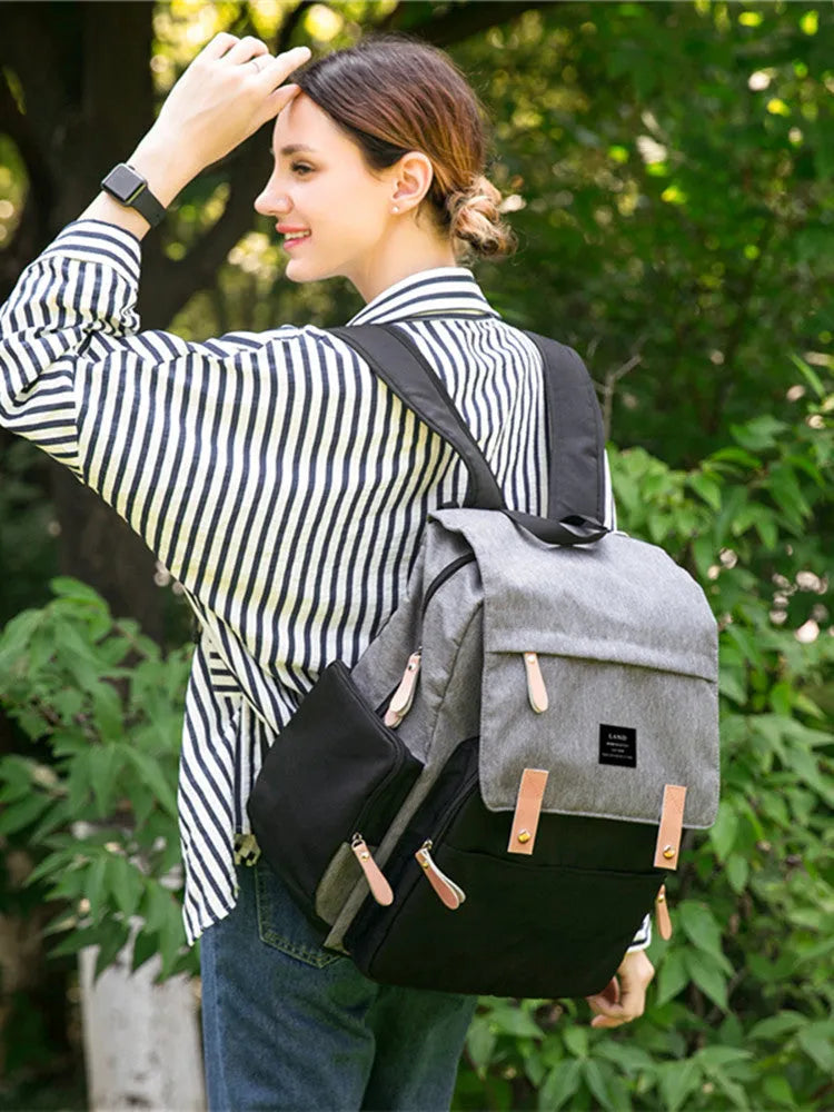 LAND Mommy Diaper Bag Backpack in oxford cloth with changing mat, shown in beige colour.