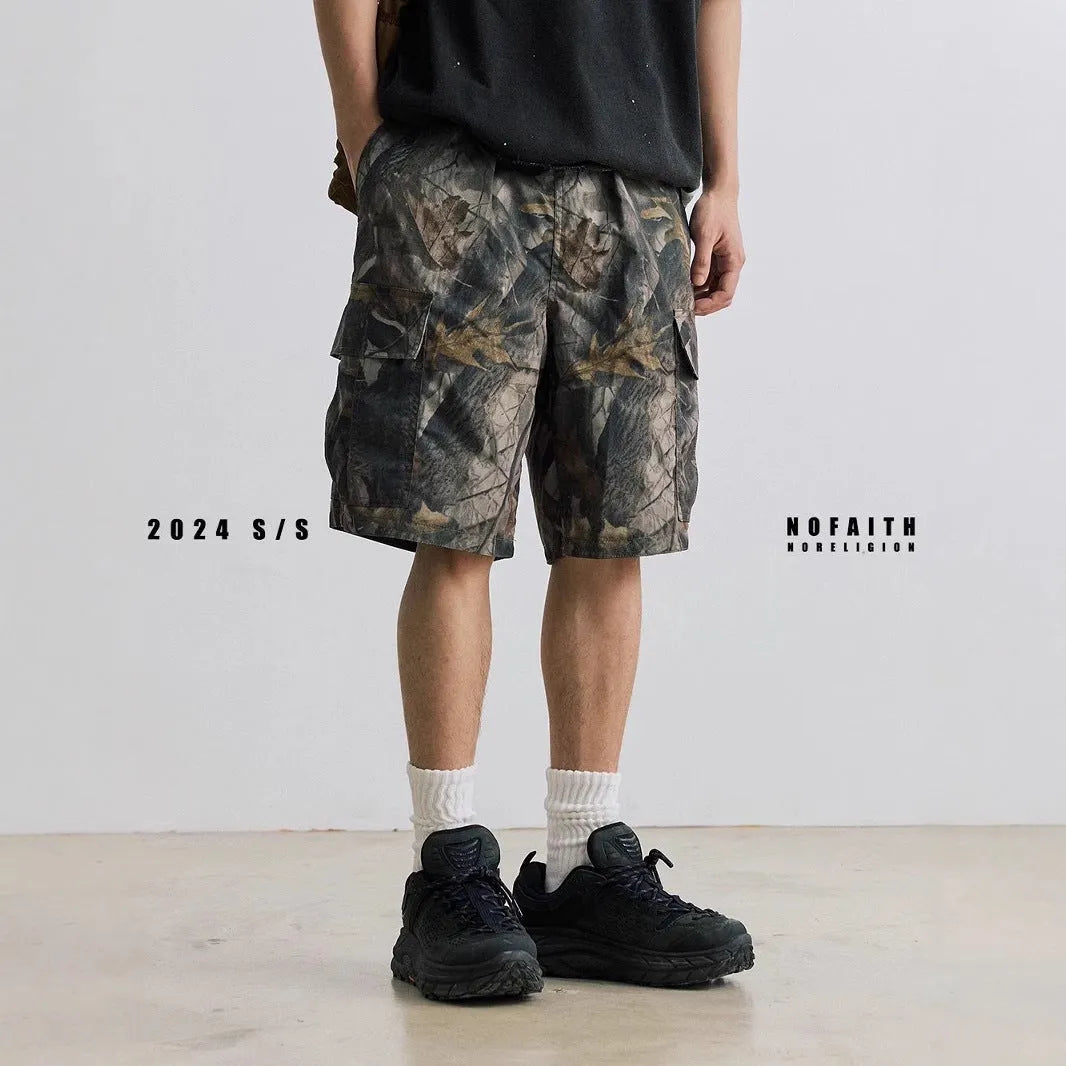 Loose fit denim shorts in army green with a straight leg and elastic waistband.