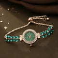 Round women's quartz watch with diamond accents and fine leaf band in green colour